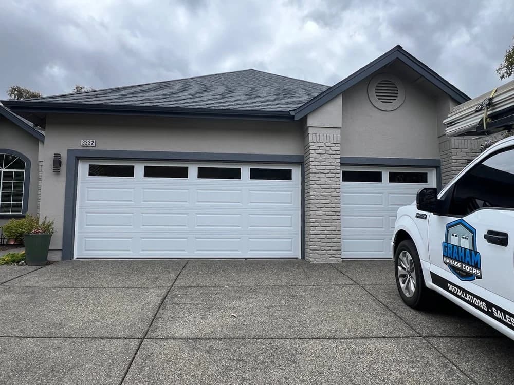 White raised panel garage doors with window inserts